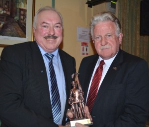 Walter receives a statuette from Denis Mulchay New York