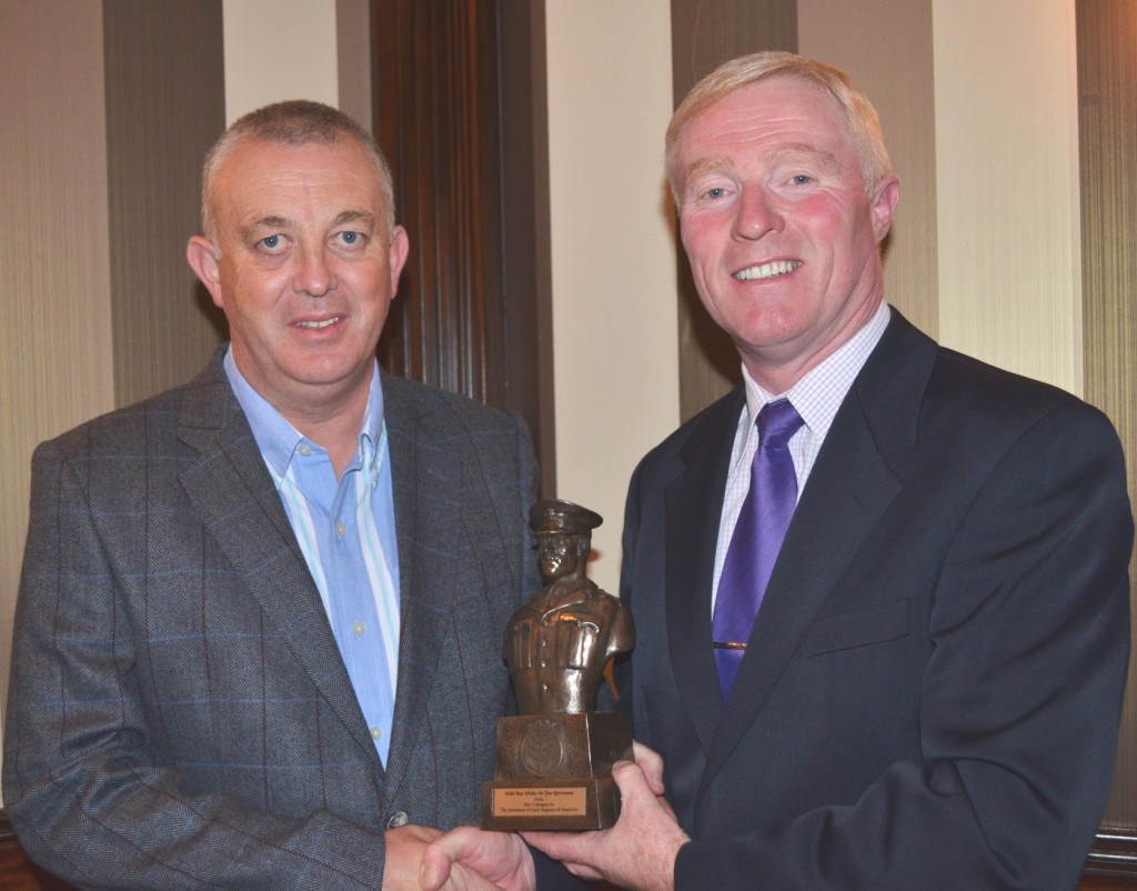 Declan Hunt presents the AGSI Retirement Bust to John