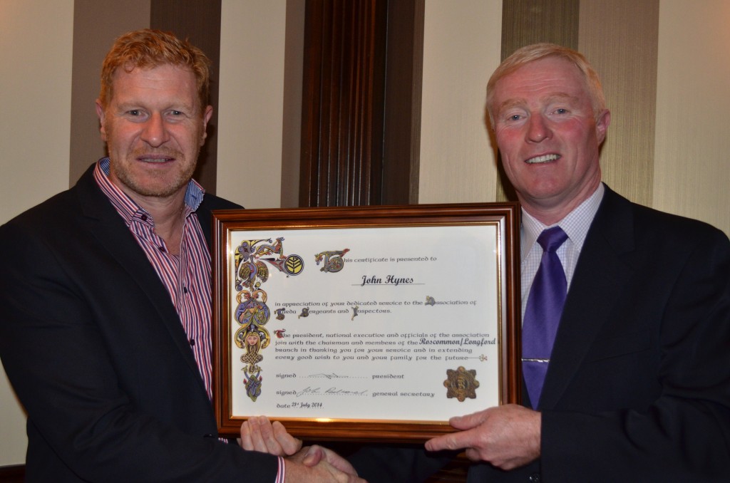 AGSI General Secretary John Redmond presents an AGSI Scroll to John Hynes